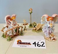 Group shot of both angels and three garden accessories