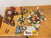 All four songbird sculptures arranged on surface