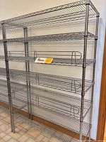 Full frontal view showing entire shelving unit with six wire shelves