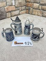 All four stoneware steins group view