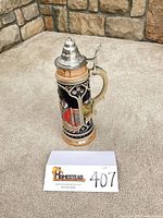 Full view of stein front showing height and decorative panel