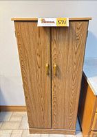 front view of closed oak-look two-door cabinet