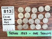 Top-down view of all 20 coins with label noting before 1947