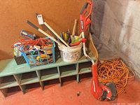 Overall lot with string trimmer, extension cords, bucket and crate of garden tools
