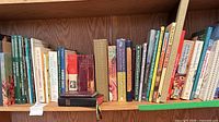 Full shelf view showing assortment of gardening, art, reference books