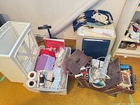 Overall lot showing Bernina sewing machine, clear bin of fabrics and wooden notions box