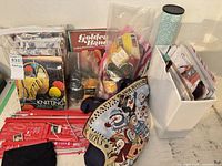 overview of books, needles in sleeves, yarn bag, pattern holder