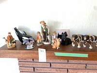 All nine figurines arranged on mantel