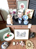 Group shot of all porcelain, glass and art items on hearth