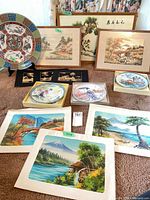 Overview of all items: charger, boxed plates, framed prints, unframed prints, inlay plaques