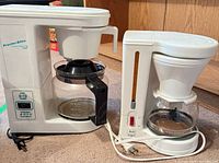 Proctor-Silex and Melitta coffee makers side by side