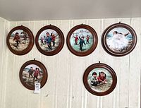 Six round plaques mounted on wall
