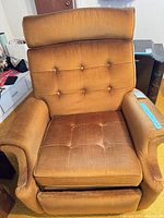Front view of brown velour recliner chair upright