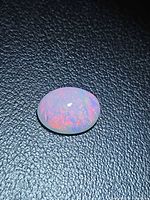 Top view of opal showing red and blue play-of-color