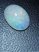 Top view of oval Ethiopian opal showing play-of-color