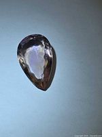 Front view of pear-cut ametrine showing bicolour purple and yellow zoning