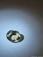 Oval lemon citrine front view on neutral background