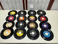 All 16 records laid out front-label up