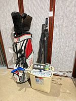 Full lot: stand bag, bucket of balls, umbrellas, ball retriever