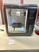 Front view of FlashForge Adventurer 3 Lite printer showing build plate and control panel