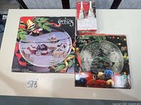 Three boxes for plates and candle holders on table