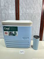 Front view of Igloo cooler and insulated tumbler for scale