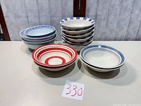Full lot showing all 14 bowls in three groups
