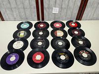 16 records laid out in 4×4 grid