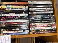 Full shelf view showing both stacks of DVD cases