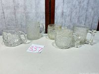 Group shot of all five promotional mugs