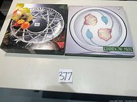 Both boxed platters shown side by side