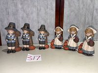 Full set of six pilgrim figurines displayed