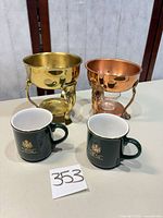 Full lot showing two mugs and two metal chafing stands
