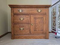 Front view showing drawers, door, hardware, wood grain