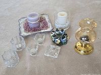 Group shot showing all nine candle holders on carpet