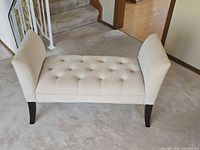 Full view of beige upholstered bench