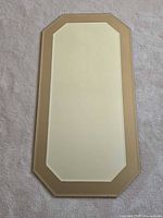 Front view showing full mirror shape and tint