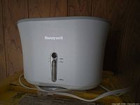 Front view showing Honeywell logo, water-level indicator and power cord