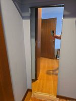 Full view of tall frameless wall mirror