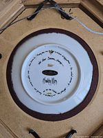 Backstamp of P. Buckley Moss Anna Perenna plate showing series and 2003 date