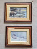 Both framed Robert Bateman wildlife prints side by side for size, frame and subject view