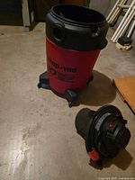 Canister on caster base with detached motor head