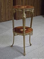 Full view of two-tier side table showing metal frame and two wooden shelves