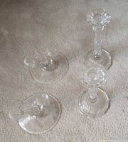 Top view of four crystal candlesticks showing arrangement and etched bases.