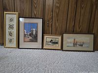 Four framed prints side by side