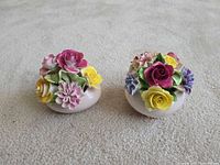 Two Royal Adderley bone china floral bouquet pots on carpet