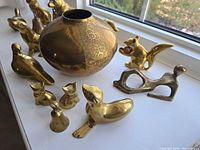 Group shot showing vase, animal figurines, bells