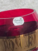 Close-up of Bohemia Crystal label on ruby red glass