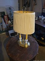 Full view of lamp with shade on round base