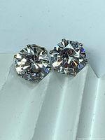 close-up of both synthetic diamond stud fronts